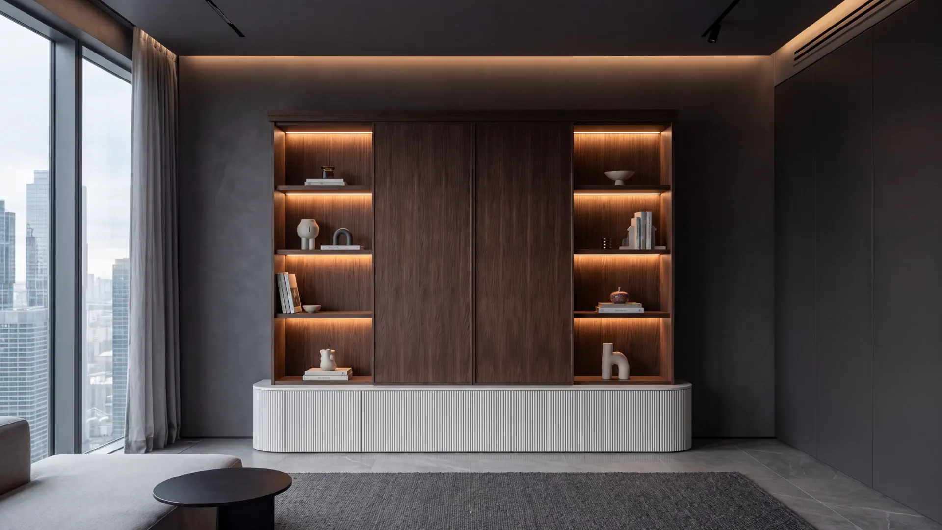 Walnut doors on the VELA Wall slide aside to reveal a screen set in marble, then close over it again