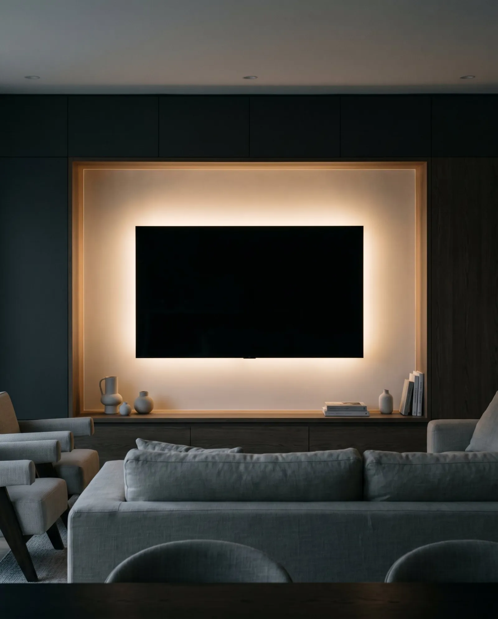 A television set in a recessed niche with a soft halo of light