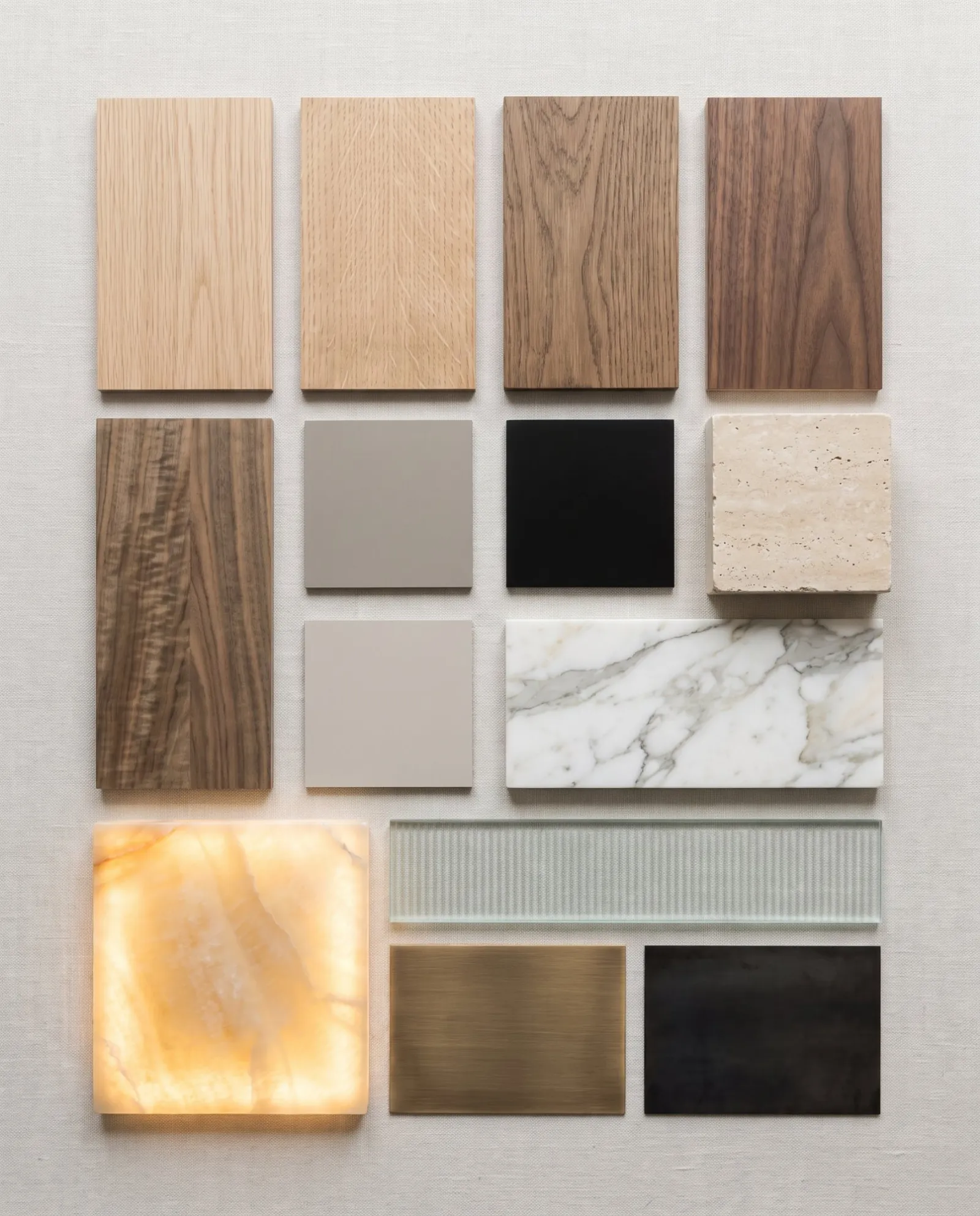 Samples of oak, walnut, lacquer, travertine, marble, onyx, reeded glass, bronze and steel