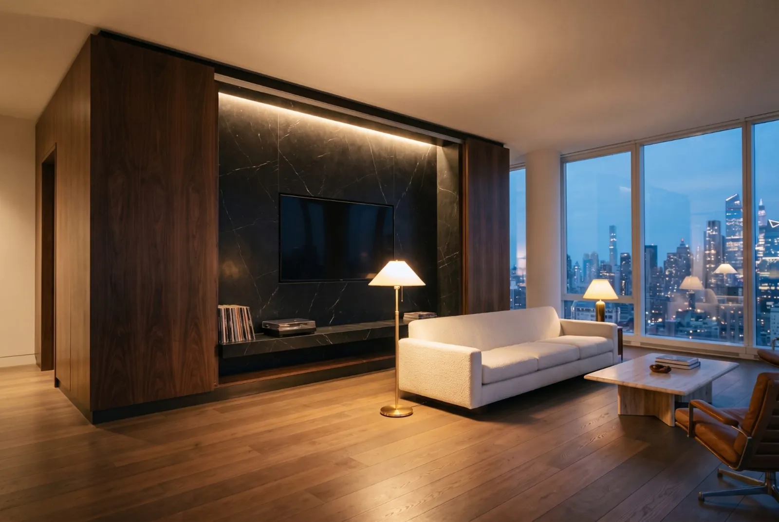 Dark figured wood panels open onto a black marble media wall at dusk